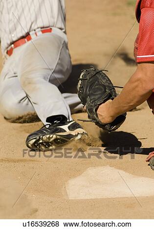 Baseball players at home base, (close-up) View Large Photo Image Stock Photo - Baseball players at home base, (close-up). Fotosearch