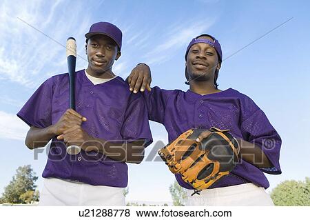 Stock Photo - Baseball players, outdoors, (portrait). Fotosearch