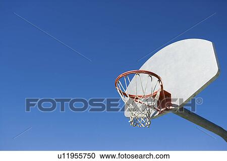 Stock Image - Basketball hoop, low angle view. Fotosearch