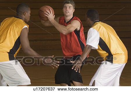 Basketball match on indoor court View Large Photo Image Stock Photo - Basketball match on indoor court. Fotosearch