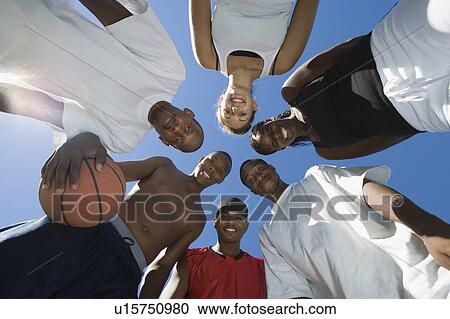 Stock Image - Basketball Players, view from below. Fotosearch