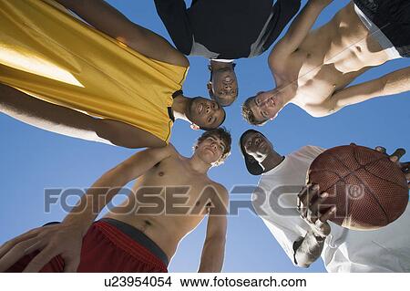 Picture - Basketball team huddle. Fotosearch