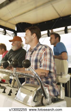 Boaters in cabin View Large Photo Image Stock Photography - Boaters in cabin. Fotosearch
