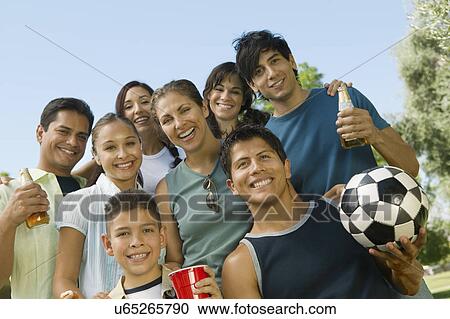 Boy (13-15) with family at park, low angle view. View Large Photo Image Stock Image - Boy (13-15) with family at park, low angle view.. Fotosearch