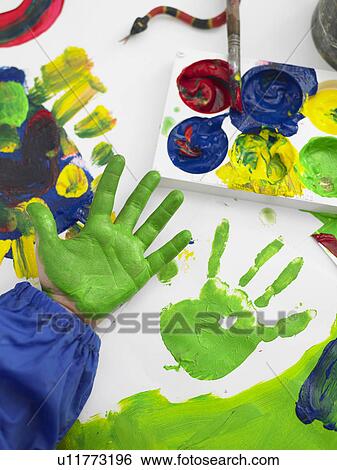 Boy finger painting, close up on hand View Large Photo Image Stock Photograph - Boy finger painting, close up on hand. Fotosearch
