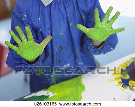 Stock Photography - Boy finger painting in art class, mid section. Fotosearch