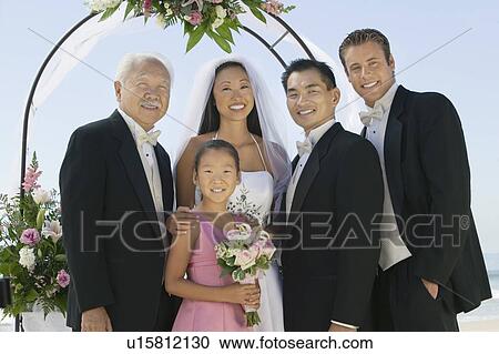 Bride and Groom with best man and family, outdoors, (portrait) View Large Photo Image Stock Image - Bride and Groom with best man and family, outdoors, (portrait). Fotosearch