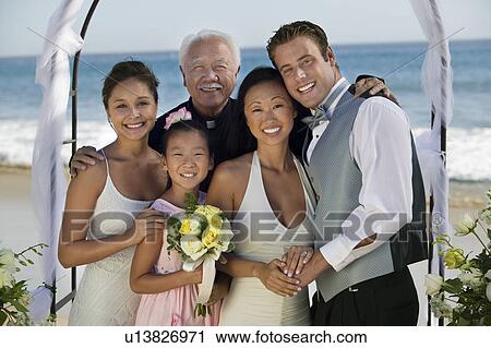 Bride and Groom with family at beach wedding, (portrait) View Large Photo Image Stock Image - Bride and Groom with family at beach wedding, (portrait). Fotosearch