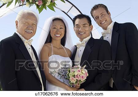 Bride and Groom with father and best man, outdoors, (portrait) View Large Photo Image Stock Photograph - Bride and Groom with father and best man, outdoors, (portrait). Fotosearch
