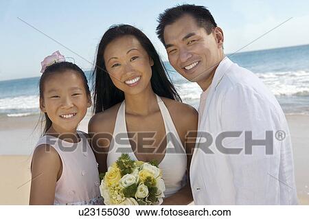 Bride and Groom with sister on beach, (portrait) View Large Photo Image Stock Image - Bride and Groom with sister on beach, (portrait). Fotosearch