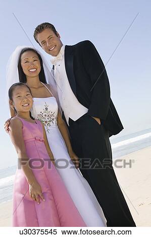 Bride and Groom with sister on beach, (portrait) View Large Photo Image Stock Photography - Bride and Groom with sister on beach, (portrait). Fotosearch