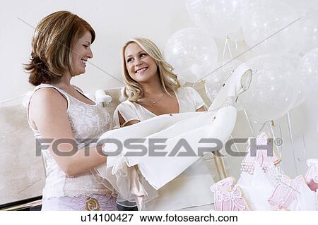 Bride Showing Off Dress at Bridal Shower View Large Photo Image Stock Photo - Bride Showing Off Dress at Bridal Shower. Fotosearch
