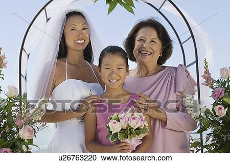 Bride with mother and sister, outdoors, (portrait) View Large Photo Image Stock Image - Bride with mother and sister, outdoors, (portrait). Fotosearch