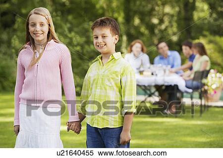 Brother and Sister Holding Hands in back yard, portrait View Large Photo Image Stock Photography - Brother and Sister Holding Hands in back yard, portrait. Fotosearch