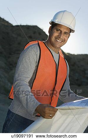 Builder with blueprint for new home, portrait View Large Photo Image Stock Image - Builder with blueprint for new home, portrait. Fotosearch