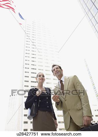Stock Image - Business colleagues in street. Fotosearch