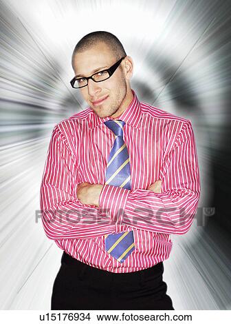 Business man in glasses, smiling, in front of light effect View Large Photo Image Picture - Business man in glasses, smiling, in front of light effect. Fotosearch