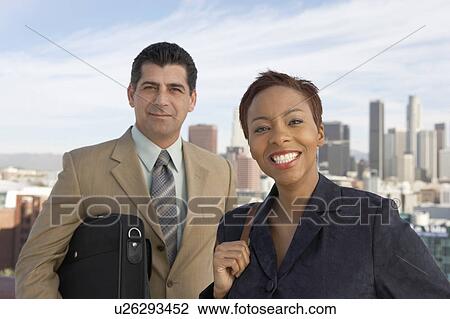 Business people smiling in city View Large Photo Image Stock Image - Business people smiling in city. Fotosearch