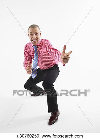 Businessman gesturing in studio View Large Photo Image Stock Photo - Businessman gesturing in studio. Fotosearch