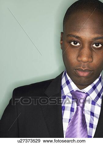 Businessman in studio, head and shoulders View Large Photo Image Stock Photo - Businessman in studio, head and shoulders. Fotosearch