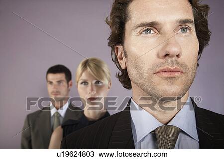 Stock Image - Businessman leading team of colleagues. Fotosearch