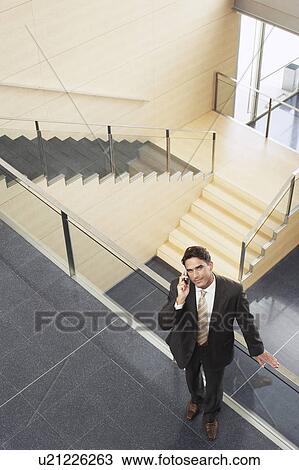 Businessman Talking on Cell Phone, elevated view View Large Photo Image Stock Image - Businessman Talking on Cell Phone, elevated view. Fotosearch