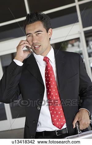 Businessman Using Cell Phone outside office, half length View Large Photo Image Stock Image - Businessman Using Cell Phone outside office, half length. Fotosearch