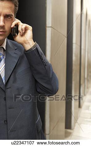 Businessman using mobile phone. View Large Photo Image Stock Photo - Businessman using mobile phone.. Fotosearch