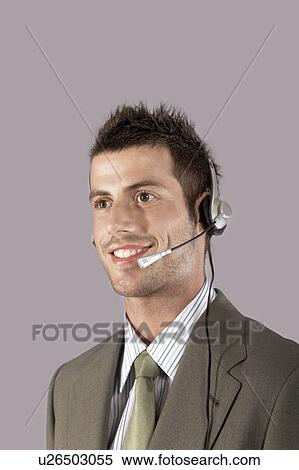 Businessman wearing headset, portrait View Large Photo Image Stock Photography - Businessman wearing headset, portrait. Fotosearch