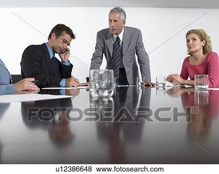 Businesspeople in conference meeting View Large Photo Image Stock Photo - Businesspeople in conference meeting. Fotosearch