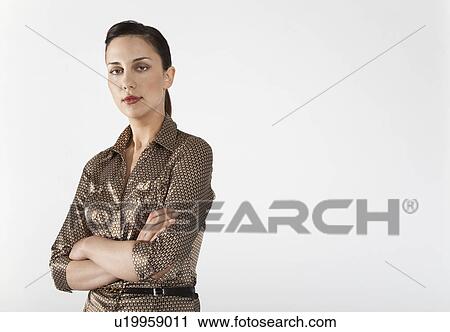 Businesswoman with arms crossed, on white background, portrait View Large Photo Image Stock Image - Businesswoman with arms crossed, on white background, portrait. Fotosearch