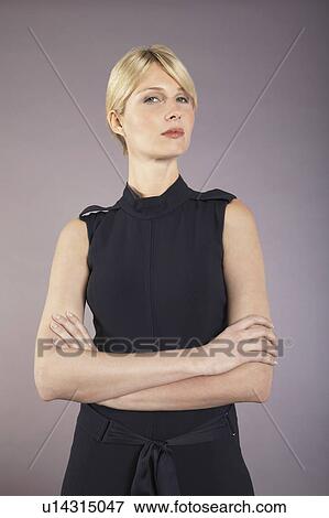 Businesswoman with arms crossed, portrait View Large Photo Image Stock Photo - Businesswoman with arms crossed, portrait. Fotosearch