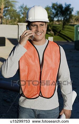 Construction worker using mobile phone, portrait View Large Photo Image Stock Image - Construction worker using mobile phone, portrait. Fotosearch