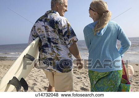 Couple at beach View Large Photo Image Stock Photo - Couple at beach. Fotosearch