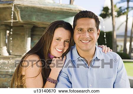 Couple by fountain, portrait View Large Photo Image Stock Image - Couple by fountain, portrait. Fotosearch