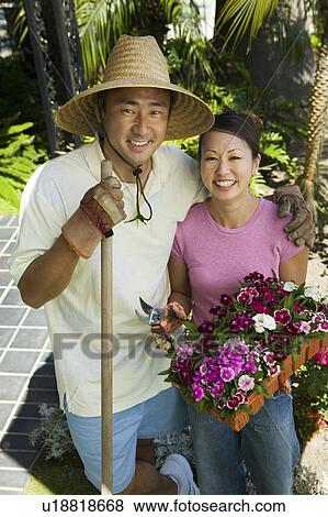 Couple gardening, (portrait), (elevated view) View Large Photo Image Stock Photo - Couple gardening, (portrait), (elevated view). Fotosearch