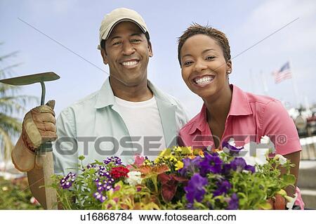 Couple gardening, (portrait) View Large Photo Image Picture - Couple gardening, (portrait). Fotosearch