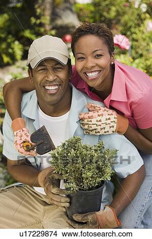 Picture - Couple gardening, (portrait). Fotosearch