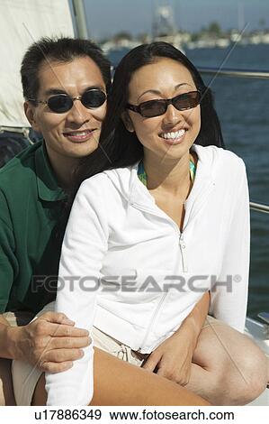 Couple on sailboat, (portrait) View Large Photo Image Stock Photo - Couple on sailboat, (portrait). Fotosearch