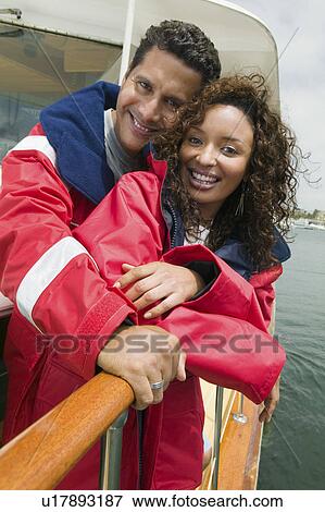 Stock Photo - Couple on yacht, (portrait). Fotosearch