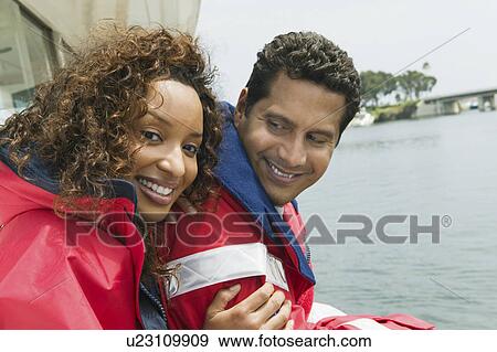 Stock Photo - Couple on yacht, (portrait). Fotosearch