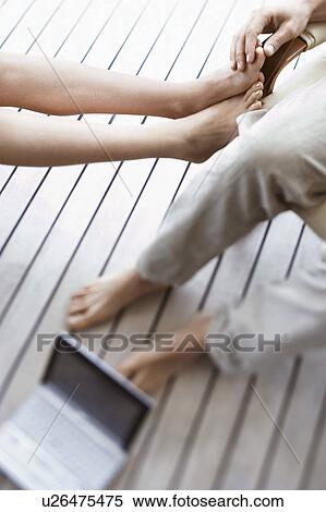Couple Relaxing on Porch with laptop, view from above. View Large Photo Image Stock Photography - Couple Relaxing on Porch with laptop, view from above.. Fotosearch