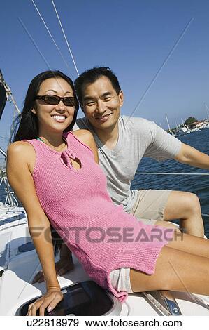 Stock Photo - Couple sailing, (portrait). Fotosearch
