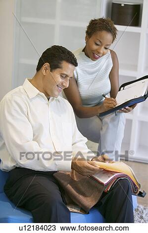 Couple Selecting Fabric From Swatch View Large Photo Image Stock Image - Couple Selecting Fabric From Swatch. Fotosearch