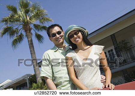 Couple smiling, outdoors, (portrait) View Large Photo Image Stock Image - Couple smiling, outdoors, (portrait). Fotosearch