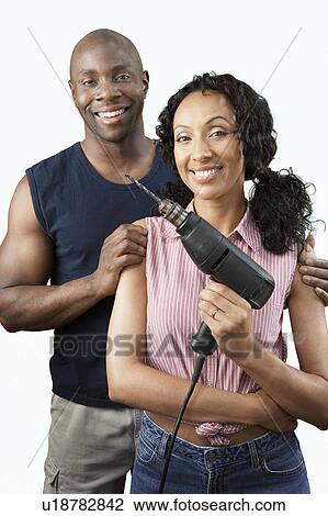 Couple with power drill, portrait View Large Photo Image Stock Image - Couple with power drill, portrait. Fotosearch