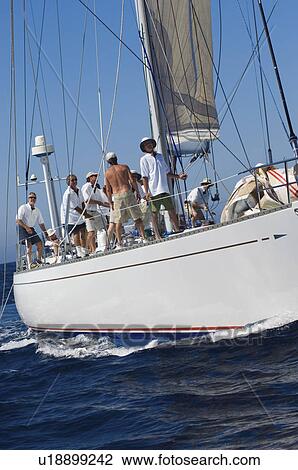 Crew on sailboat on ocean View Large Photo Image Stock Image - Crew on sailboat on ocean. Fotosearch