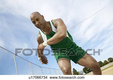 Discus Thrower Preparing to Throw View Large Photo Image Picture - Discus Thrower Preparing to Throw. Fotosearch