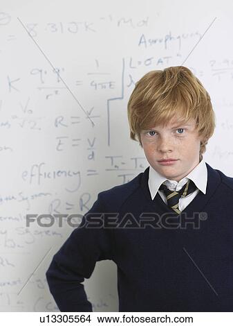 Elementary school student standing by whiteboard in math class, portrait View Large Photo Image Picture - Elementary school student standing by whiteboard in math class, portrait. Fotosearch