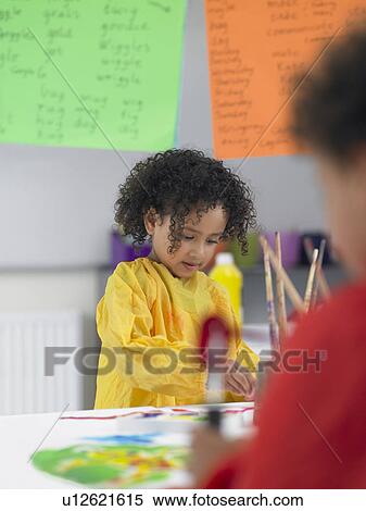 Elementary students painting in art class View Large Photo Image Stock Photography - Elementary students painting in art class. Fotosearch